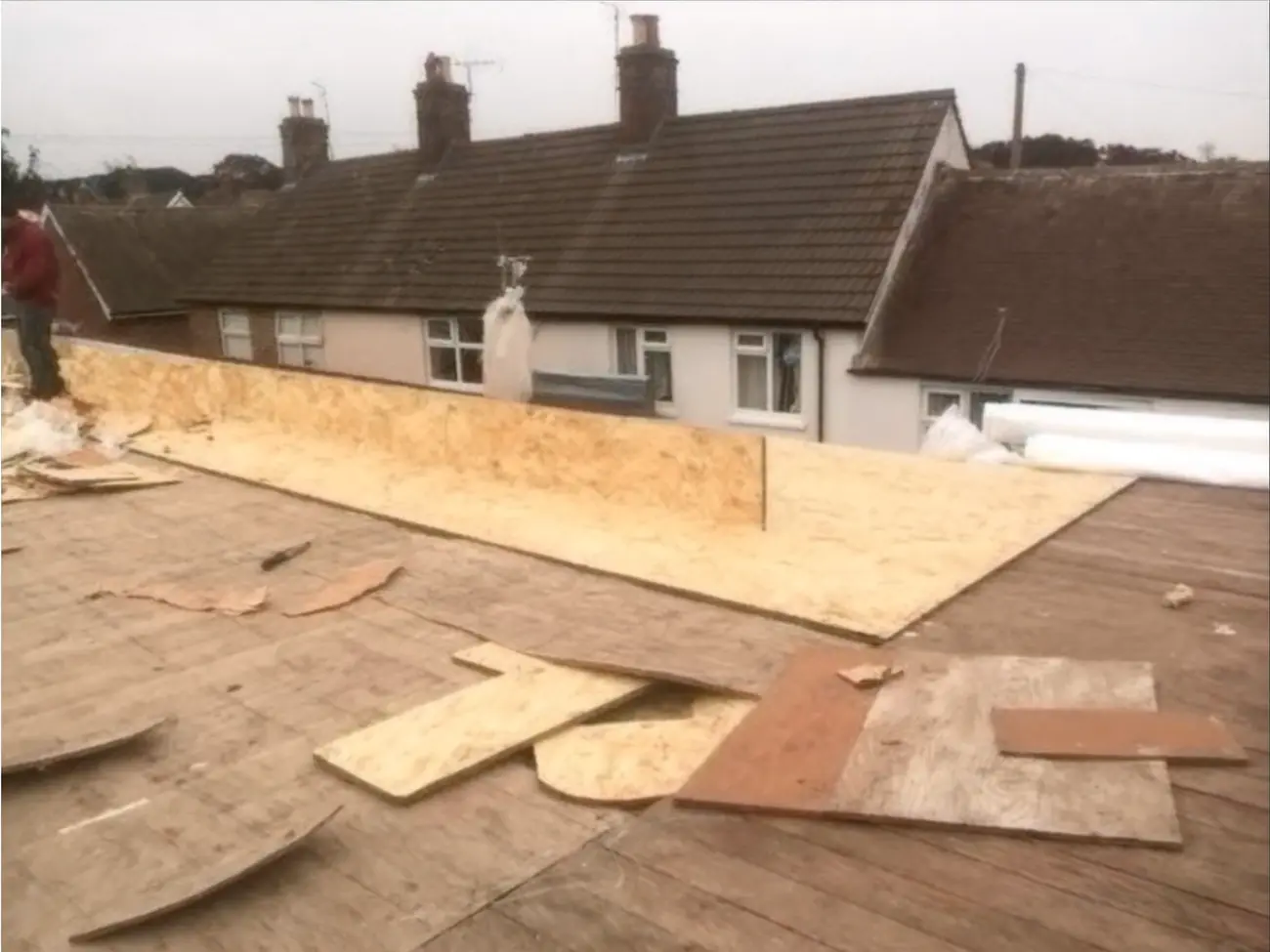 Warm deck build-up going down: insulation and tapered firrings over the timber deck