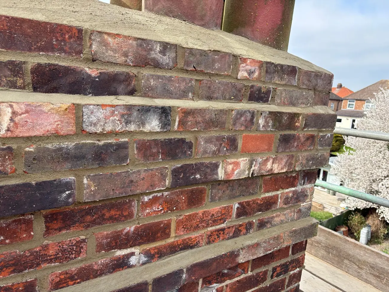 Completed chimney rebuild in Ipswich, new brickwork struck and pointed