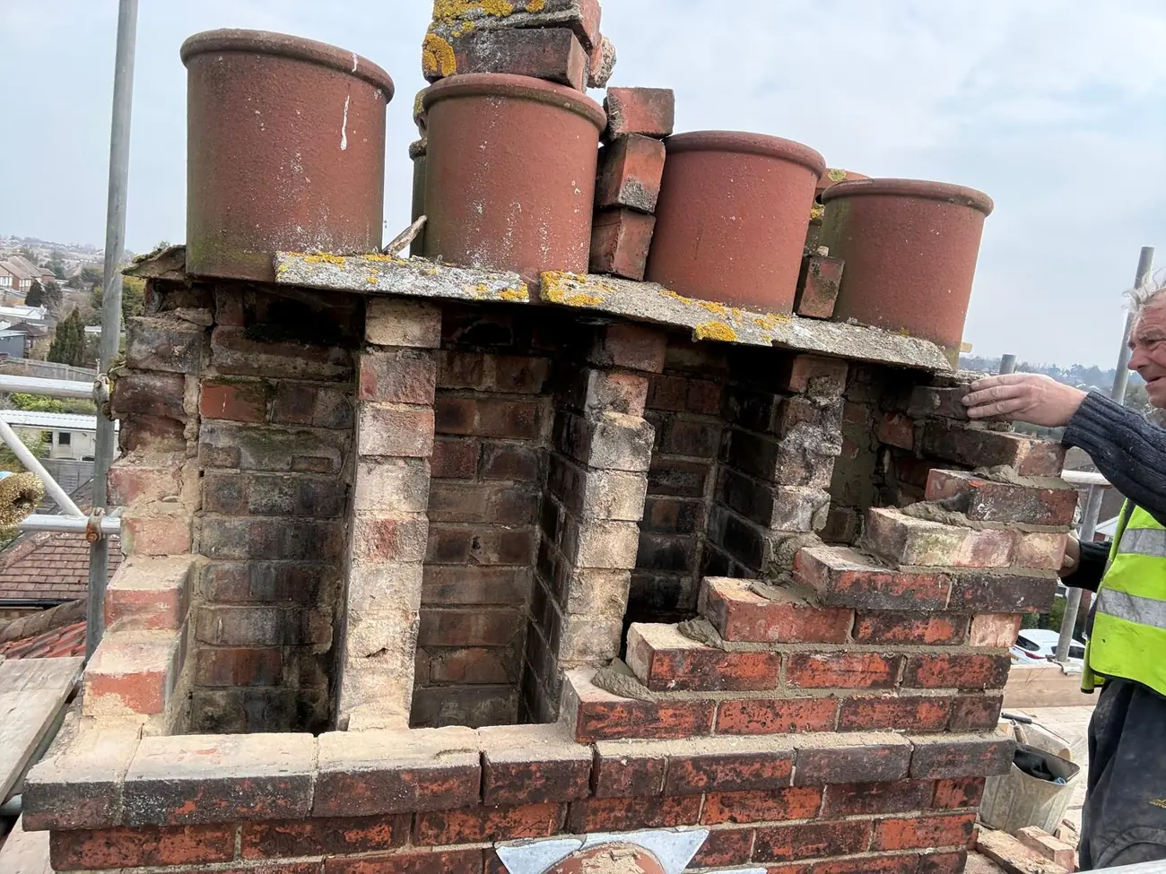 Ipswich chimney stack stripped back before rebuilding, with the pots supported