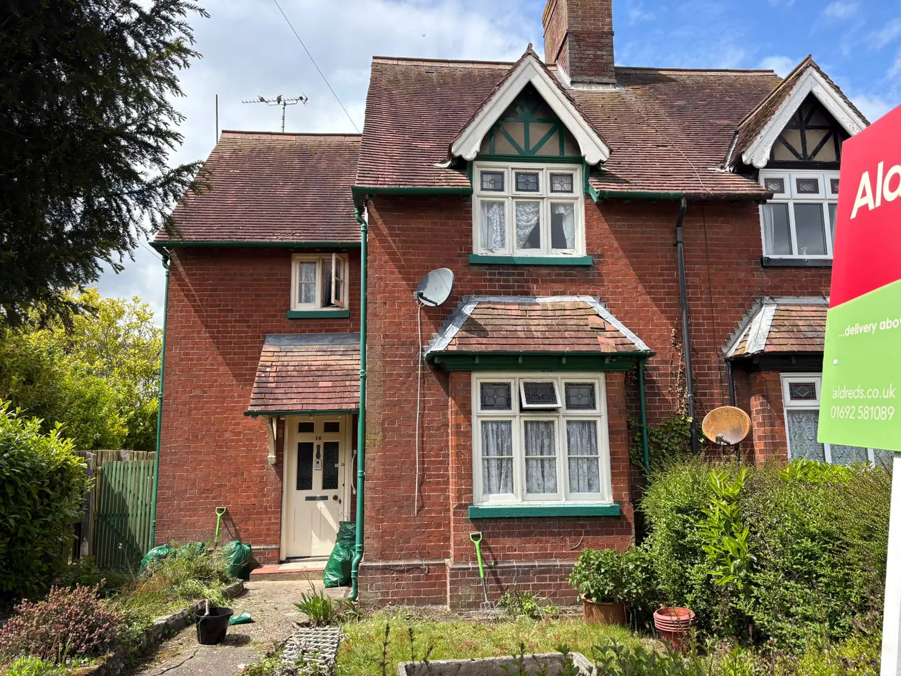 Completed clay tiled re-roof on a red-brick property in North Walsham