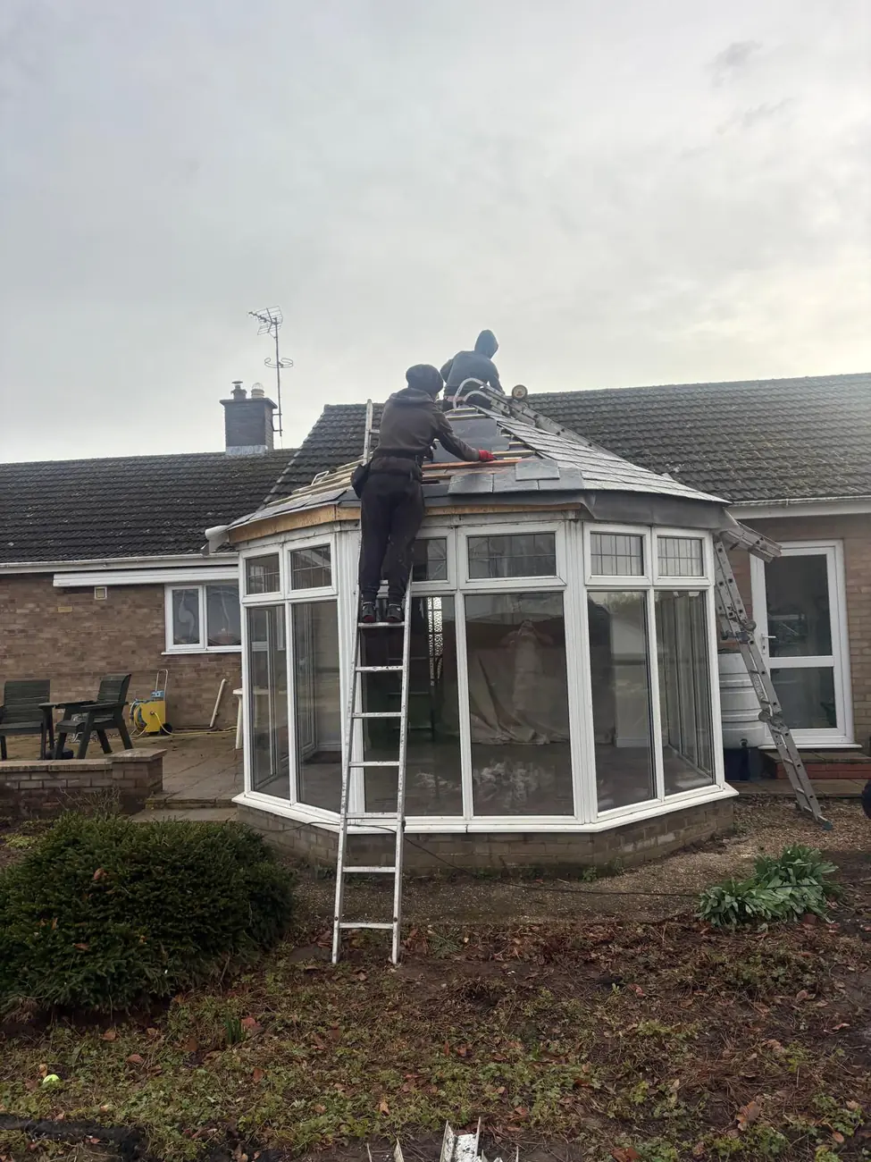 Stormproof roofers fitting a composite slate warm roof to a conservatory in Wisbech
