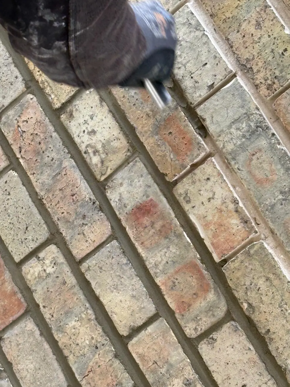 Raking out old mortar joints ready for repointing, Woodbridge, Suffolk