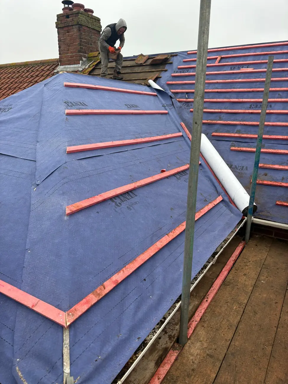 New breathable membrane and treated battens set out on a hipped roof in Ipswich