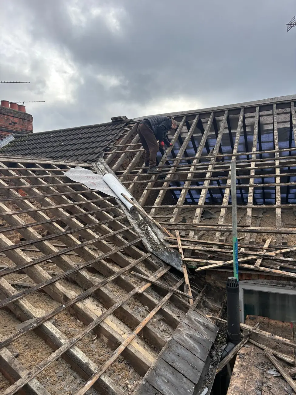Ipswich terrace roof stripped back to the rafters before new membrane and battens