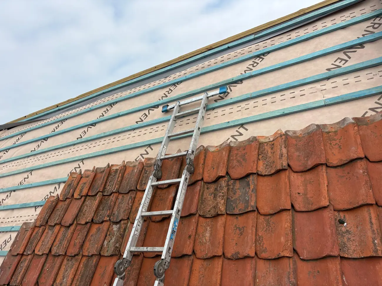 New breathable membrane and battens over stripped clay pantiles in Sheringham
