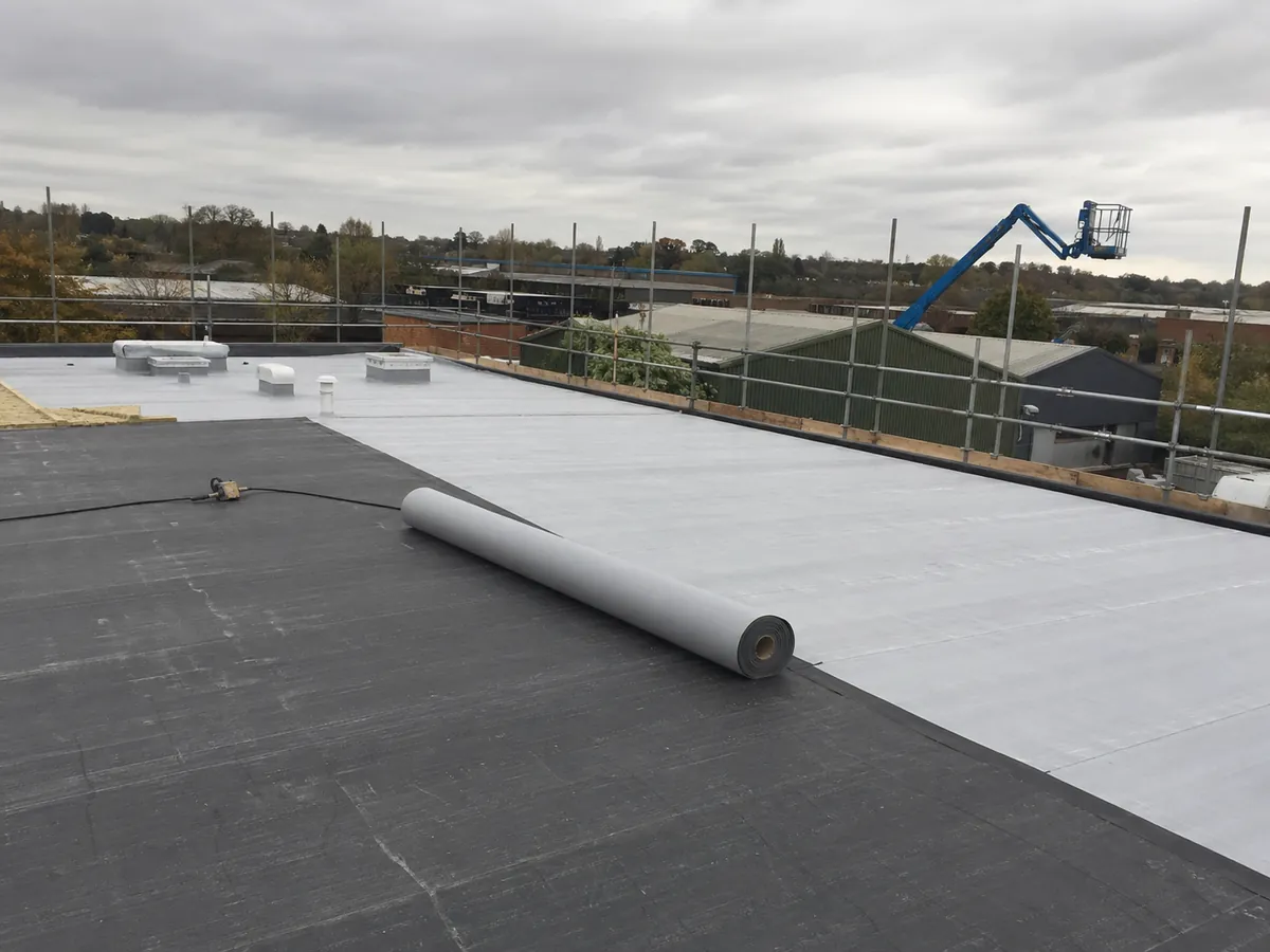 Large commercial single-ply flat roof installation in progress in Stowmarket