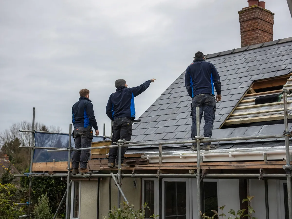 Stormproof Roofing team on scaffolding completing a slate re-roof in Suffolk